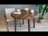 A 360-degree video showcasing the Petra round wood dining room table’s walnut wood finish, mid-century modern design, and versatile placement in various interior styles.