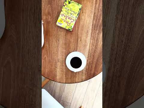 A youtube video about a walnut round coffee table for living room, made from solid wood with mid-century modern aesthetics, ideal for cozy setups.