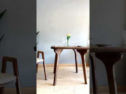 A dynamic showcase of the Sidney Mid-Century square dining table, featuring its design details, functionality, and versatility in various room setups.