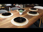 Video showcasing the Toledo walnut wooden dining table with metal legs, demonstrating its durability and style in a modern dining room.