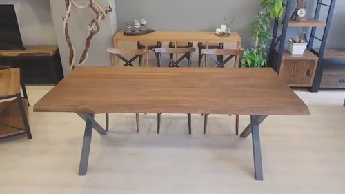 A 360-degree view of the Eagan dining table, showcasing its pine wood top and metal legs in detail.