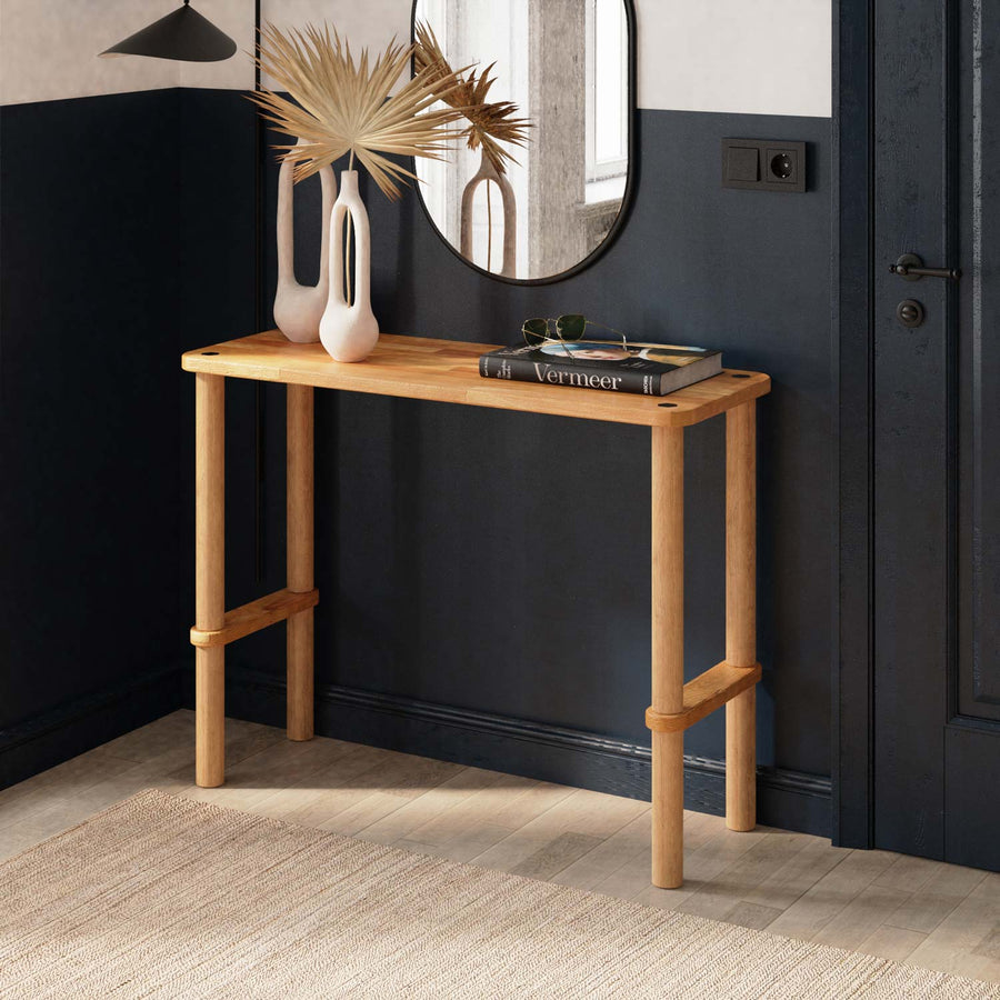 A sleek Anderson Narrow Console Table placed in a modern hallway, showcasing its solid wood construction and elegant design.
