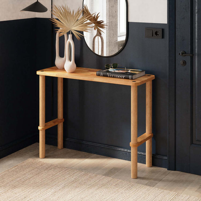 A sleek Anderson Narrow Console Table placed in a modern hallway, showcasing its solid wood construction and elegant design.