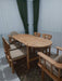 Elegant beech wood dining table showcasing its smooth oval-shaped top and minimalist design.