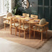 Elegant Beverly Hills oval dining table set with modern design, featuring a sleek oval table and six upholstered chairs in a contemporary dining room setting.