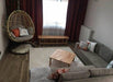 The Brooklyn Square Coffee Table styled in a modern living room, paired with decor and seating.