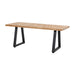 Cary Farmhouse Kitchen Table with a rectangular pine wood top and sturdy black metal legs, styled in a rustic kitchen setting