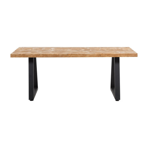 Close-up of the Cary Table showcasing its smooth pine wood surface and durable metal legs