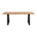 Close-up of the Cary Table showcasing its smooth pine wood surface and durable metal legs