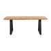Cary Farmhouse Kitchen Table with a pine wood finish, styled with matching chairs in a rustic dining space.