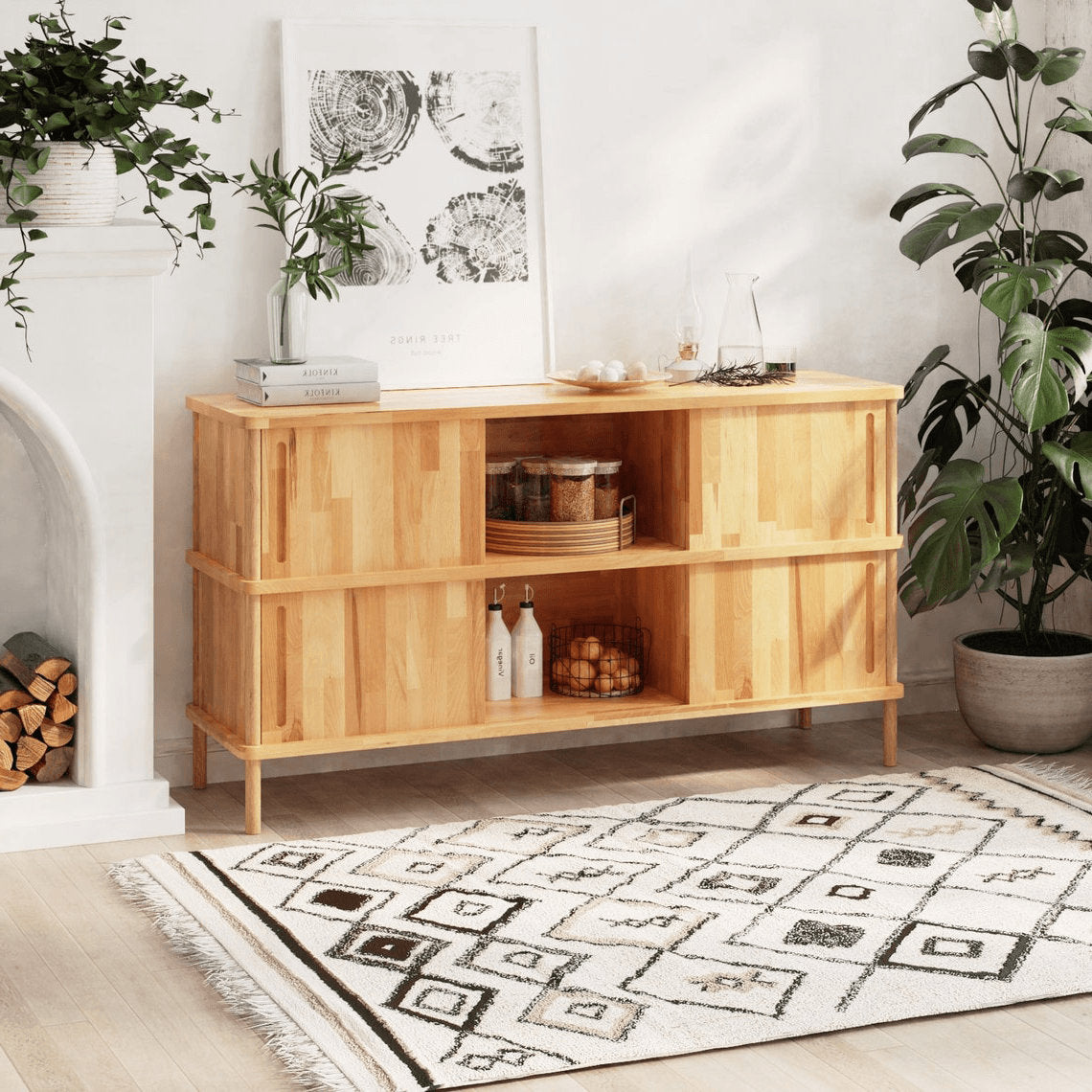 A wide view of the Compton wood dining sideboard buffet showcasing its spacious surface and clean, minimalist design with natural wood grain visible.