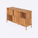 The buffet with decorative objects placed on top, adding a touch of sophistication to the room.