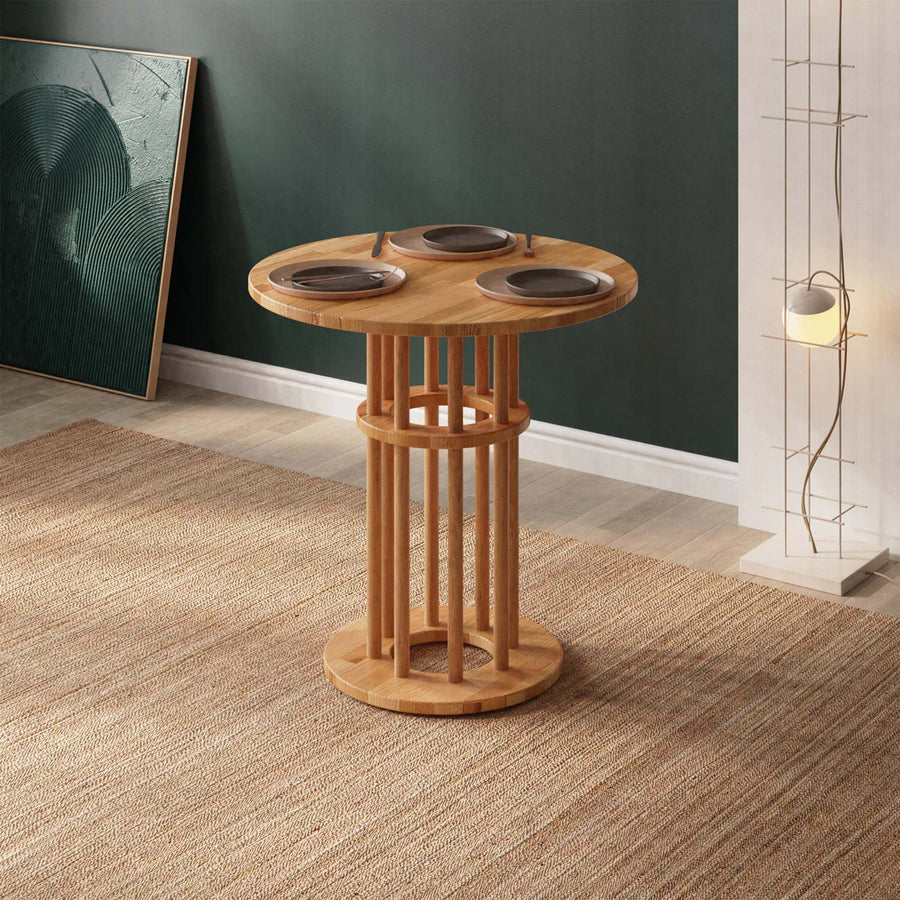 Close-up of the Grant Small Dining Table for 2, highlighting its smooth round beech wood surface in a modern minimalist kitchen setting.