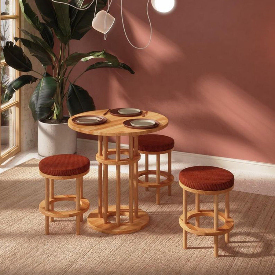 A pair of chairs with the Grant Dining Table, emphasizing the minimalist design of both.