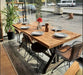 Side angle of the Table, showing the sturdy wooden legs and rustic charm