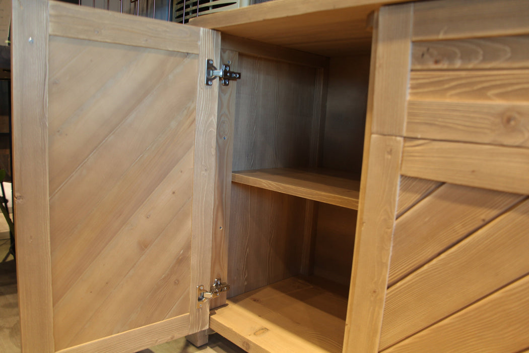 Angled view of the sideboard in a rustic living space, blending seamlessly with farmhouse or modern decor.