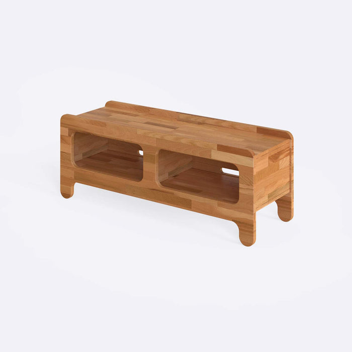 Detailed view of the open shelves, offering a closer look at the ample storage space for entertainment accessories.