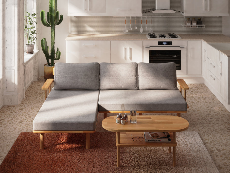 the coffee table placed against a wall with a minimalist design, emphasizing its sleek oval shape and smooth surface.