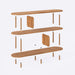 Close-up of one of the open shelves of the Malibu Low Bookcase, emphasizing the natural wood grain.