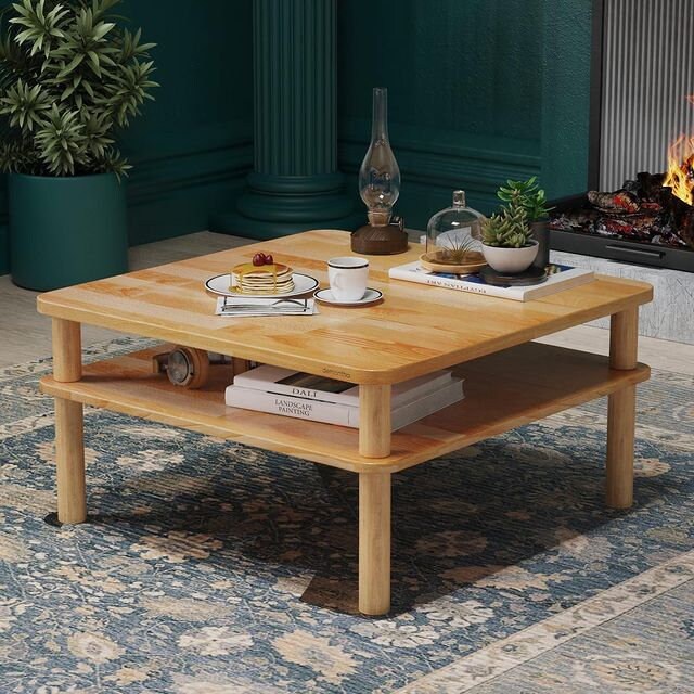 The Coffee Table placed in a living room setting, with decorative items on top and storage space visible underneath.