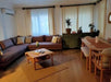 A wide-angle shot of the Table in a contemporary living room, highlighting its blend of functionality and style.