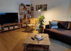 The Coffee Table with storage open, showing practical and easy-to-access compartments.