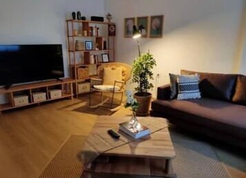 The Coffee Table with storage open, showing practical and easy-to-access compartments.