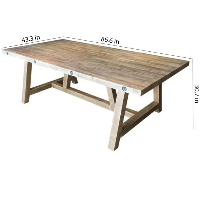 Close-up of the handcrafted wood grain detailing on the Montpelier Pine dining table surface, emphasizing its natural beauty.