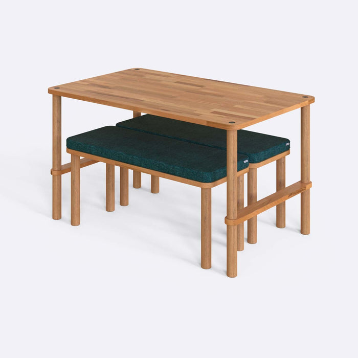 Elegant Pasific dining table set with bench shown in a cozy dining room setup with neutral tones.