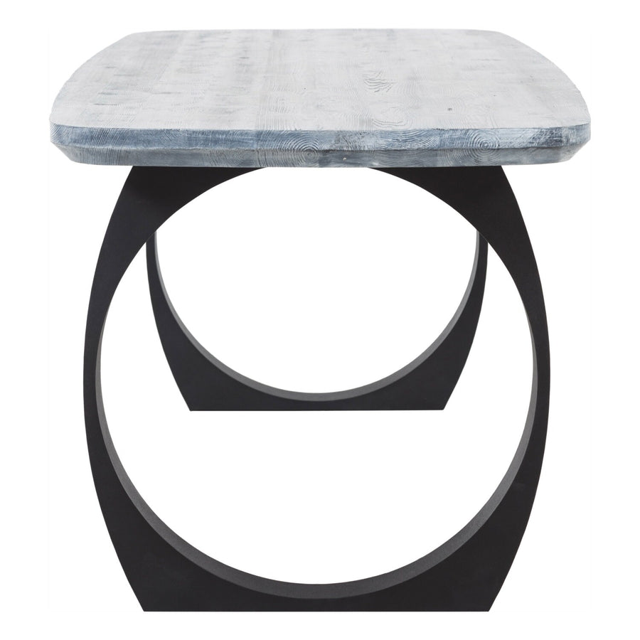Side angle of the gray dining table, highlighting its sturdy round metal legs and elegant mid-century design.