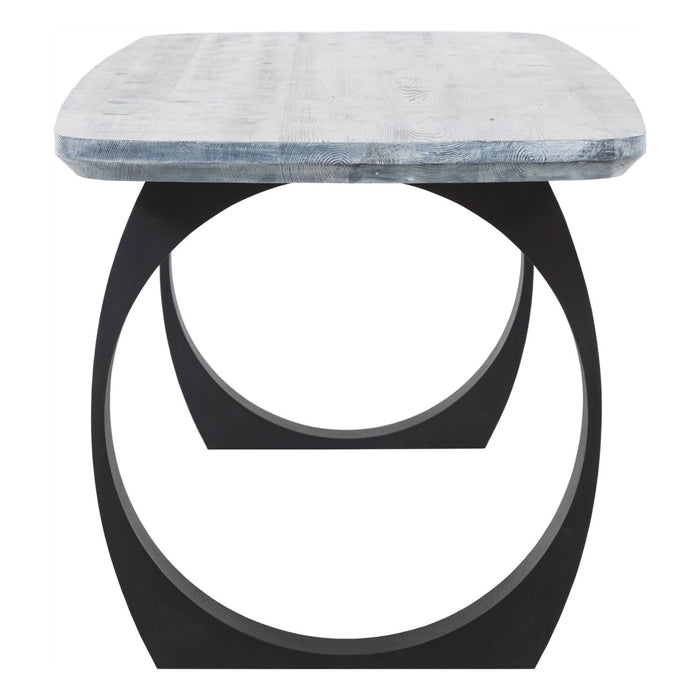 Side angle of the gray dining table, highlighting its sturdy round metal legs and elegant mid-century design.