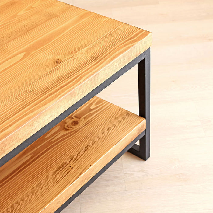 Side angle of the Portland Pine Wood Coffee Table, displaying its thick legs and solid pine wood design.