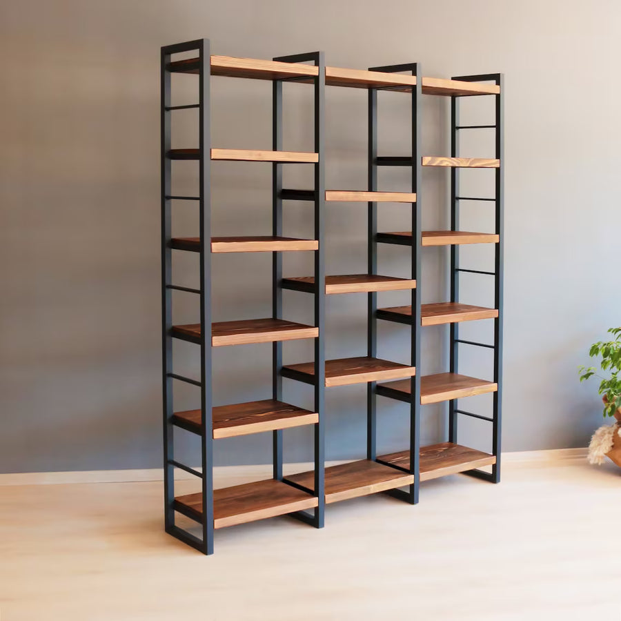 Portland Pine Room Divider Bookcase styled with books, plants, and decor, demonstrating its versatility in living spaces.