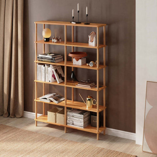 A tall and elegant natural wood bookcase with six spacious tiers, perfect for organizing books and decor.
