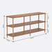 Queens Natural Wood Bookshelf in a modern living room, with books and decorative items displayed on the shelves.