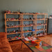Soho bookcase styled with plants and decor in a cozy room, adding a touch of elegance.