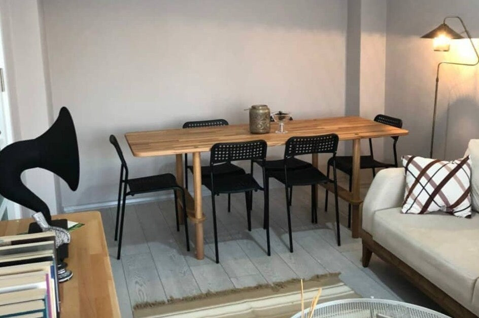 Wide view of the dining table with six chairs, perfect for gatherings.