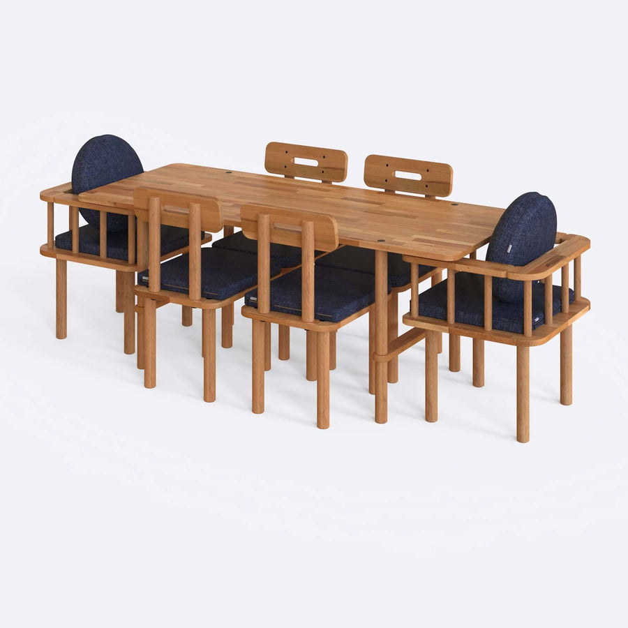  A close-up of the dining table, showcasing its sturdy design and elegant wood texture.