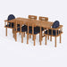  A close-up of the dining table, showcasing its sturdy design and elegant wood texture.