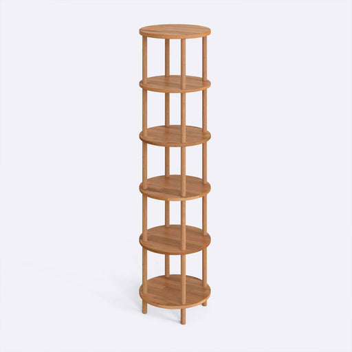 The Soho Round Bookcase positioned in a modern living room, showcasing its compact design and sturdy wood structure.