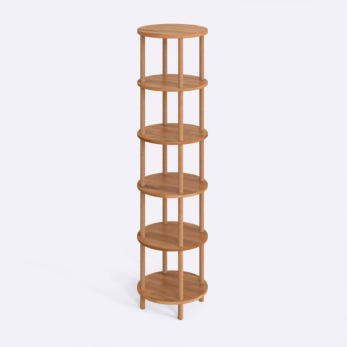 The Soho Round Bookcase positioned in a modern living room, showcasing its compact design and sturdy wood structure.