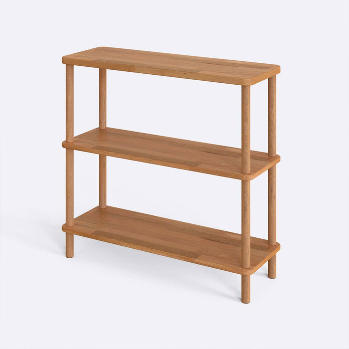 The Soho Short Bookcase placed in a contemporary living room setting, demonstrating its versatility in home decor.