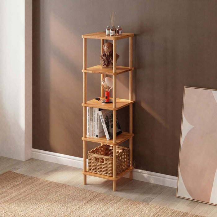 Stylish Soho bookcase against a white wall, elegantly holding books and small decor pieces.