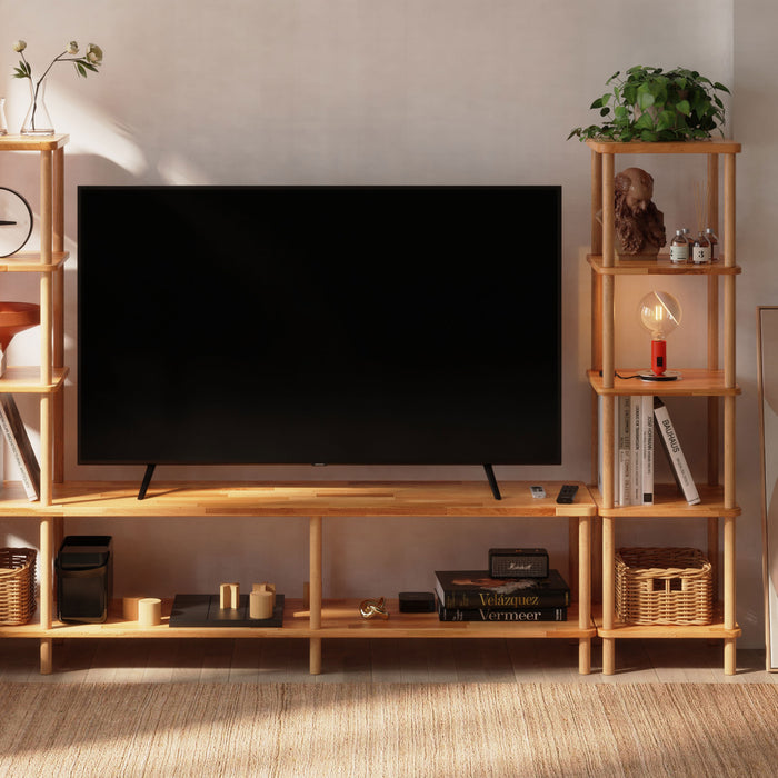 Decorated Soho Tall Skinny Bookcase in a cozy living room, paired with minimalist furniture and plants.