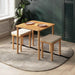 A minimalist wooden dining table with two matching benches, showcasing a sleek, modern design ideal for small spaces.