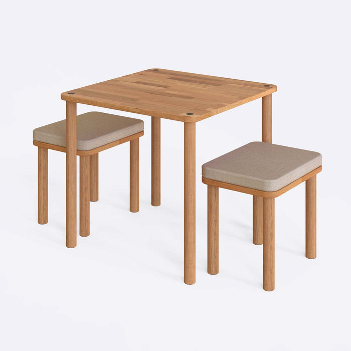 A close-up of the Soho dining table set, highlighting the smooth wood finish and minimalist aesthetic of the table and benches.