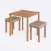 A close-up of the Soho dining table set, highlighting the smooth wood finish and minimalist aesthetic of the table and benches.