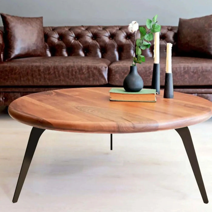 Detail shot of the metal legs on the Spark Walnut Wood Coffee Table – A close-up focusing on the black metal legs and their sleek design.