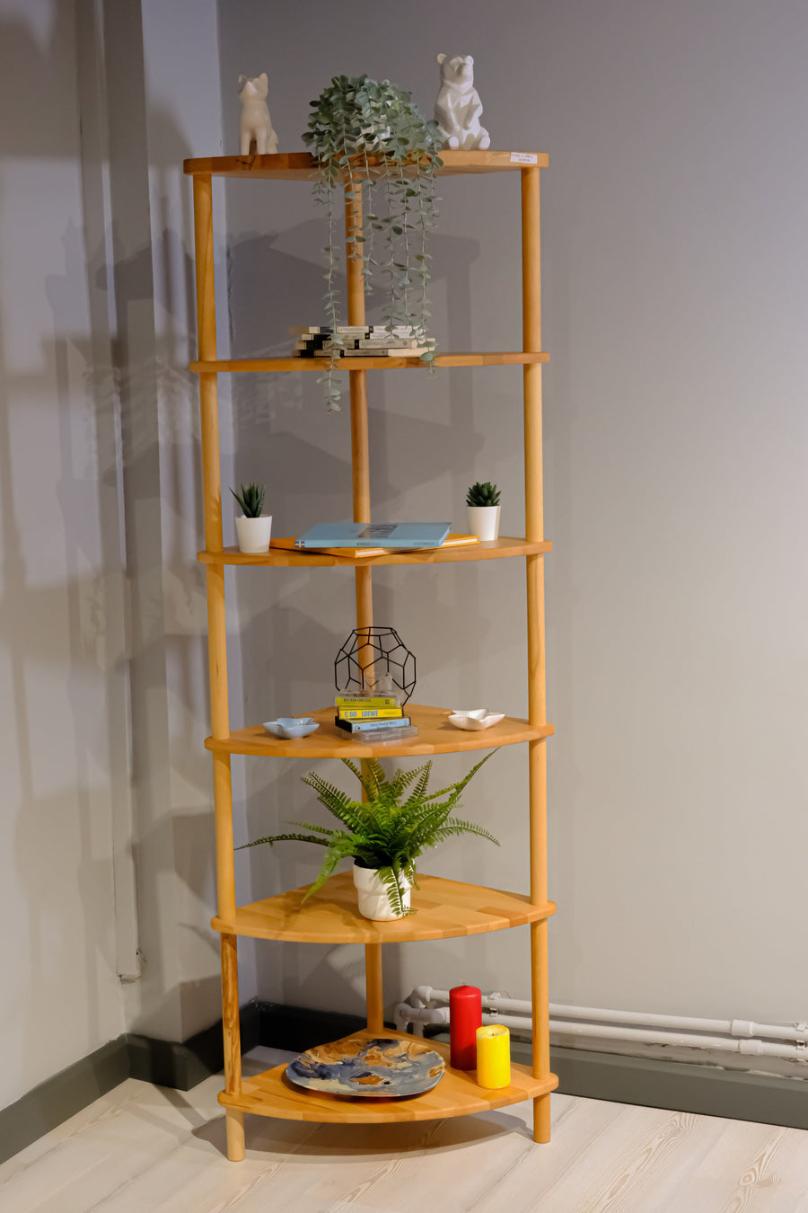 The Webb corner bookcase in a cozy home office, offering a stylish and functional storage solution for books and decor.
