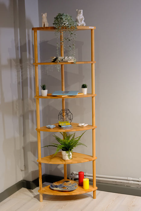 The Webb corner bookcase in a cozy home office, offering a stylish and functional storage solution for books and decor.